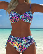 Multicolor abstract print bikini with thin straps and tied side hip bottoms