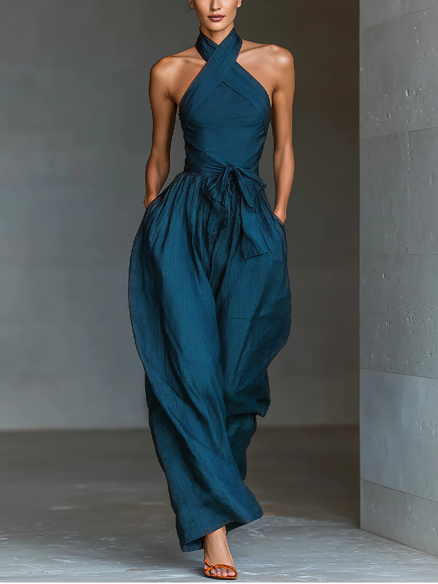 Blue halter wide-leg jumpsuit with cross neckline and gathered waist