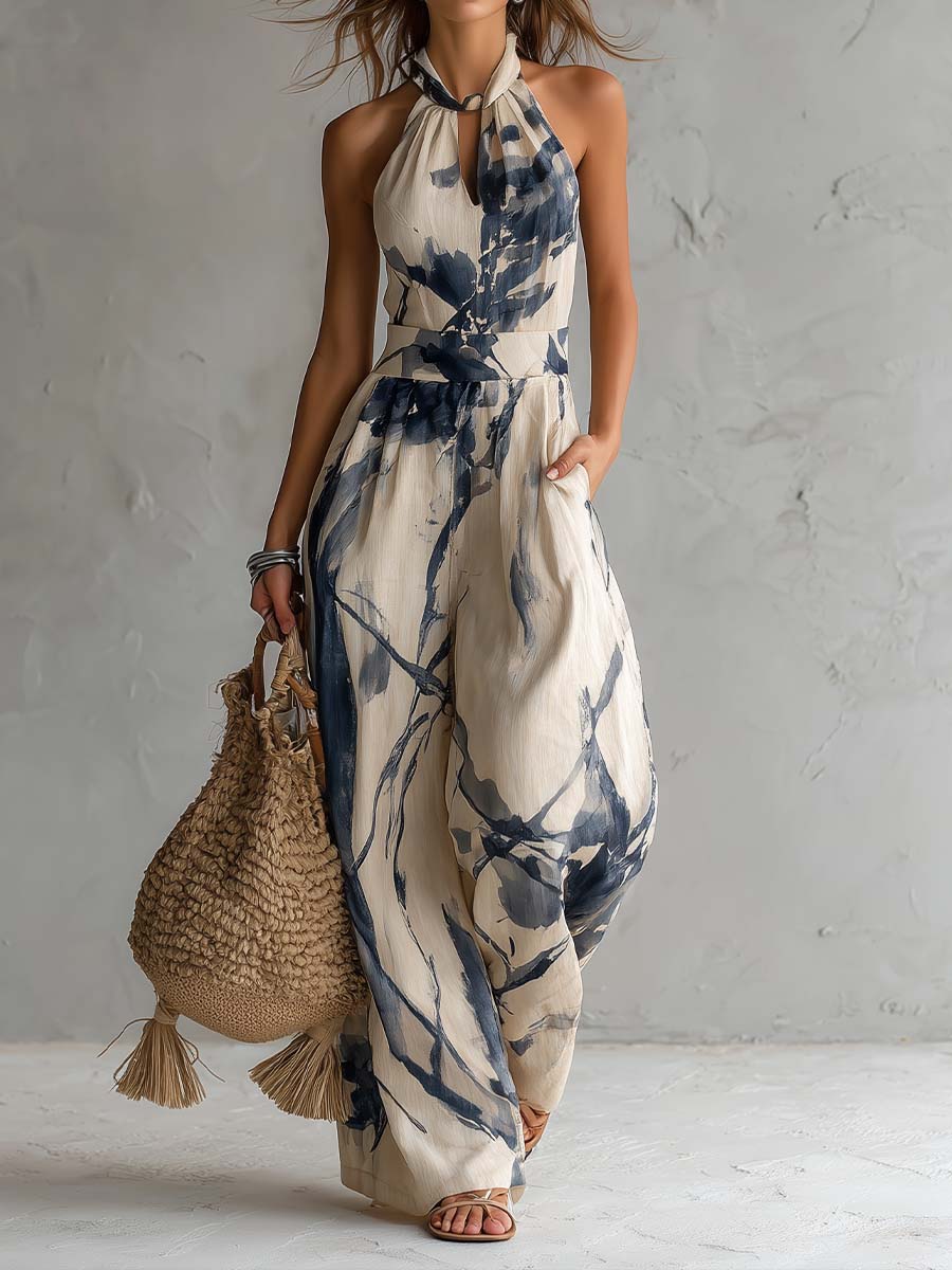 Beige halter neck wide-leg jumpsuit with blue ink-wash print and side pockets