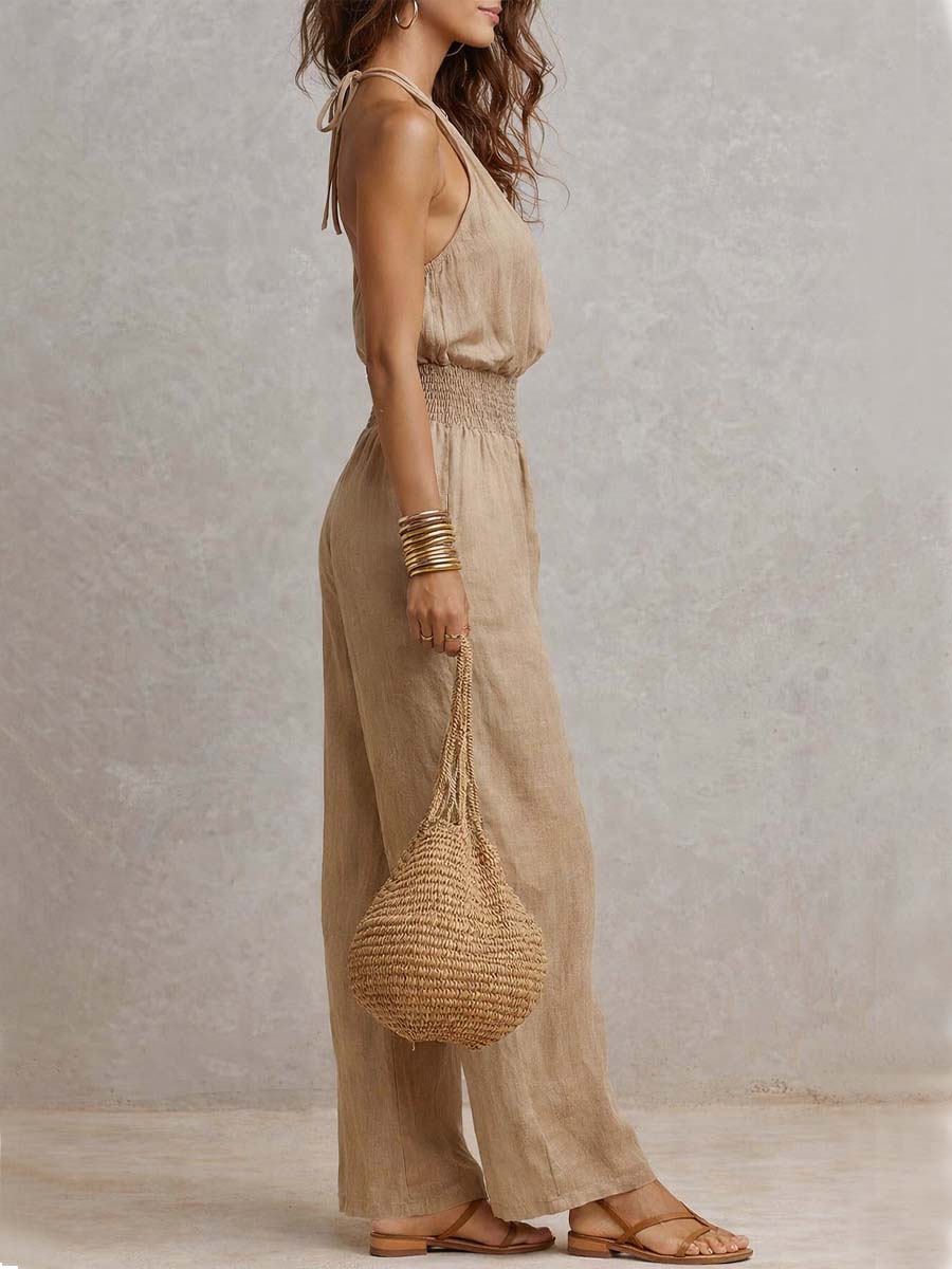 Beige halter jumpsuit with gathered bodice, smocked waist, flowy wide legs