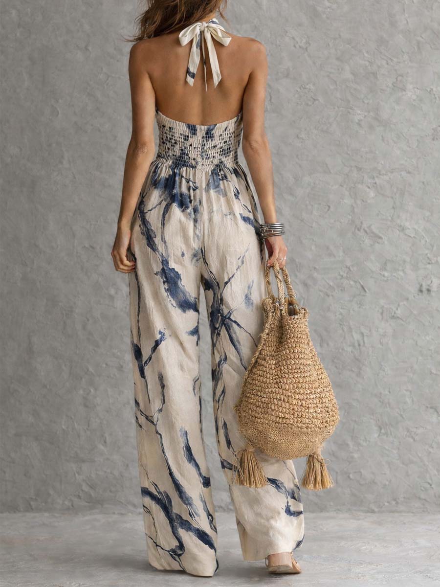Beige halter neck halter-tie wide-leg jumpsuit with blue ink-wash print