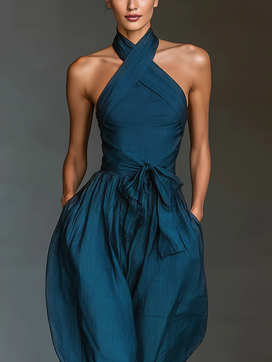 Blue cross halter jumpsuit with ruched waist and flowing wide legs