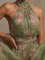 Green floral chiffon halter maxi dress with gathered halter neckline and waist seam