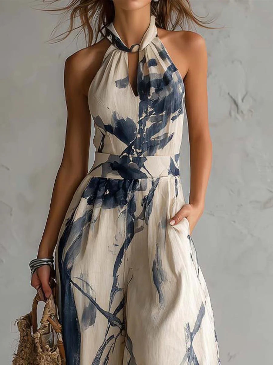 Beige halter neck jumpsuit with blue ink-wash print and tie halter neckline