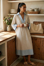 Blue and white striped midi dress with V-neck, three-quarter sleeves, and light-blue hem
