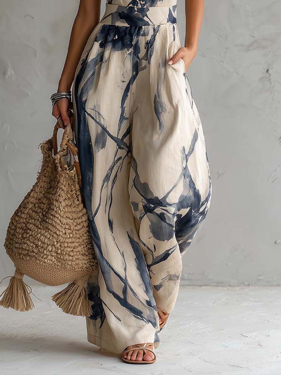 Beige wide-leg jumpsuit with blue ink-wash print and side pockets