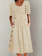 Beige striped short-sleeve summer dress with button placket and gathered skirt
