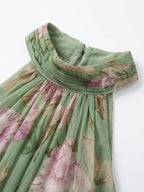 Green floral chiffon halter maxi dress with ruffled neckline and gathered bodice