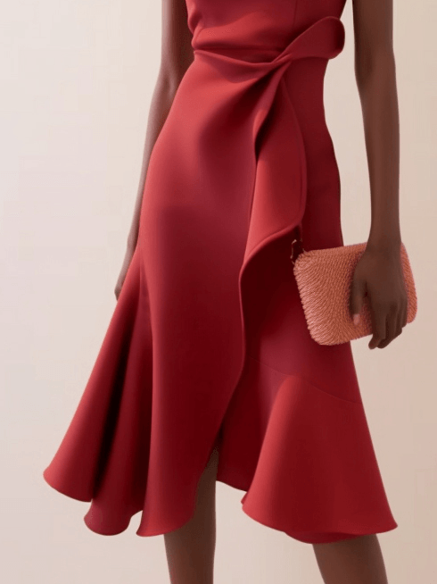 Sleeveless red midi A-line dress with side waist twist and draped detail