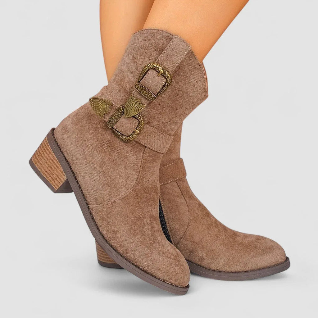 Brown suede western boots with buckled side strap and low block heel.
