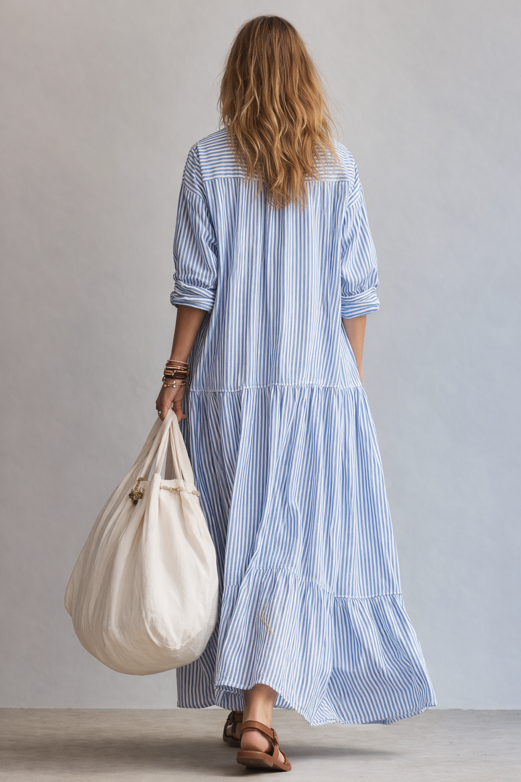 Blue and white striped maxi shirtdress with 3/4 roll sleeves and tiered skirt