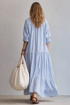 Blue and white striped maxi shirtdress with 3/4 roll sleeves and tiered skirt