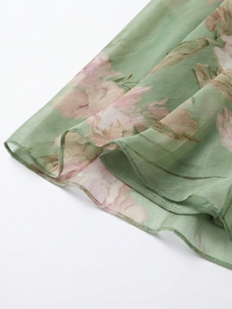 Green floral chiffon maxi dress hem with loose, flowing finish