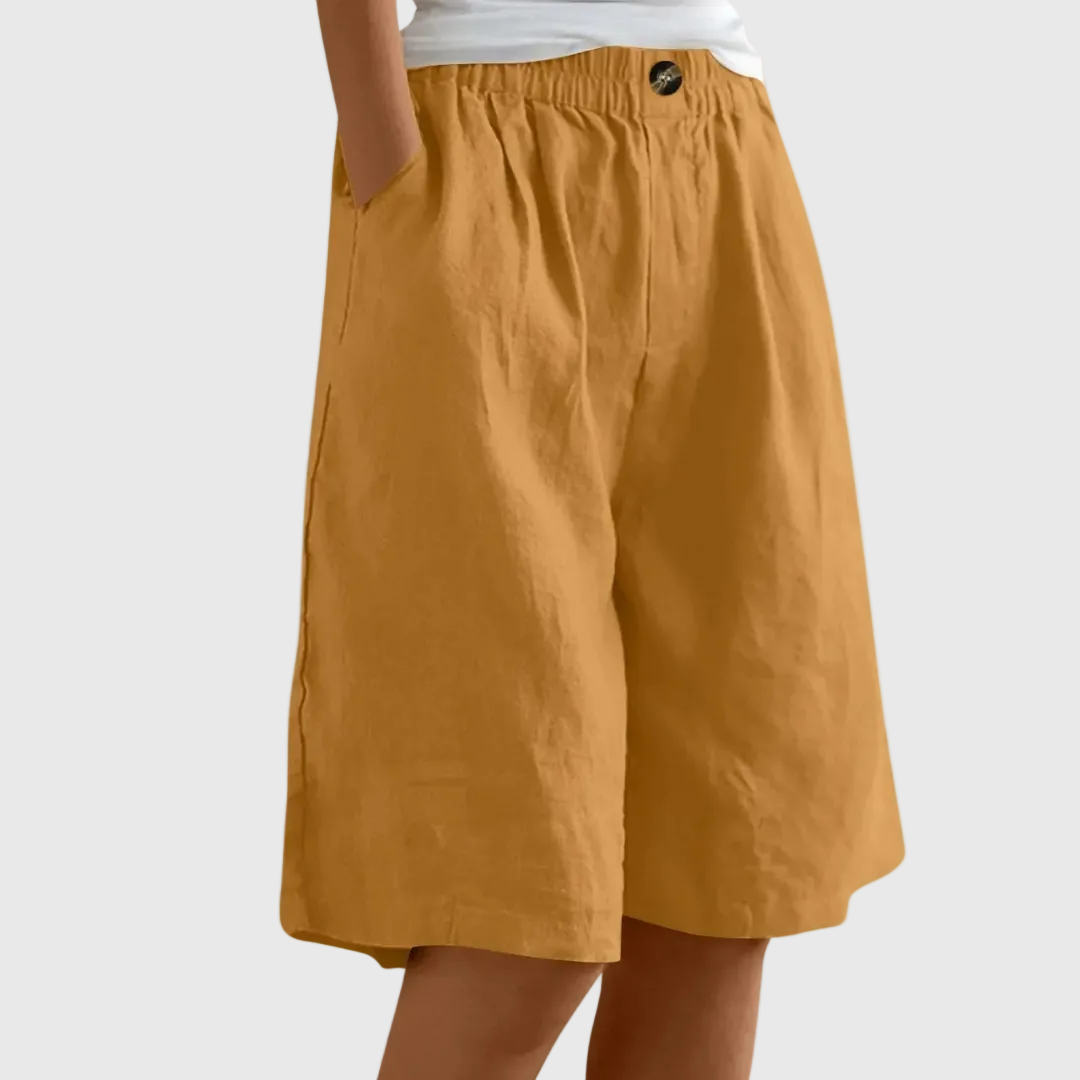 Loose fit elastic waist shorts in camel, with front seam and button detail at waistband