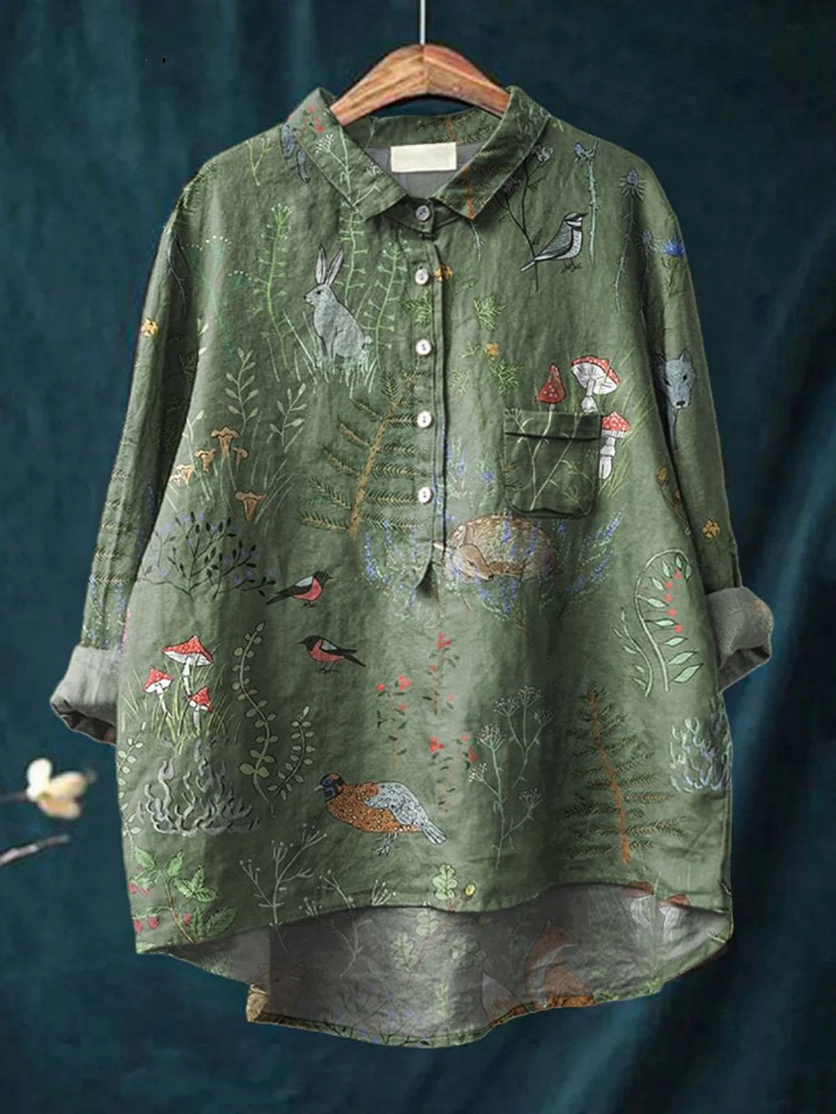 Green women's casual shirt with woodland animals repeat print, button-front and long sleeves