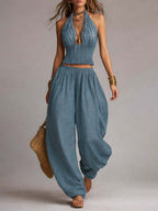 Blue halter two-piece set with fringe crop top and loose balloon pants, sleeveless