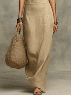 Khaki linen halter maxi dress lower half with side drape, column silhouette, and maxi hem