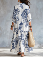 Back view: blue floral button-front maxi dress with tiered ruffle skirt