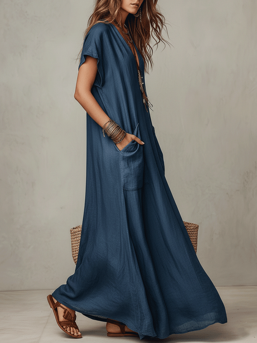 Blue relaxed maxi dress with short sleeves and draped side slit