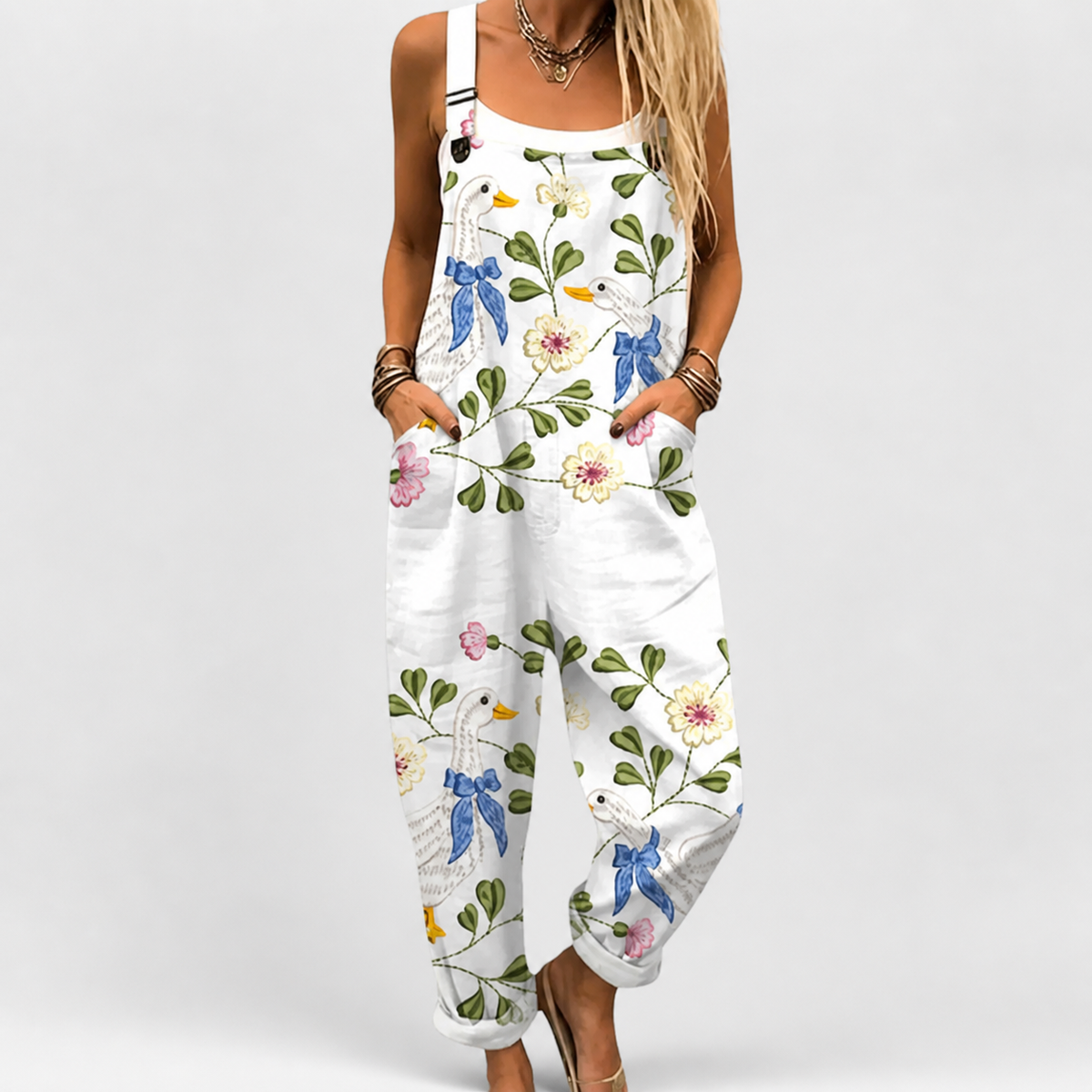 Sleeveless printed jumpsuit in white with colorful bird and floral pattern