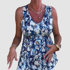 Soft breathable sleeveless top with blue-and-white abstract print, V-neck, gathered waist