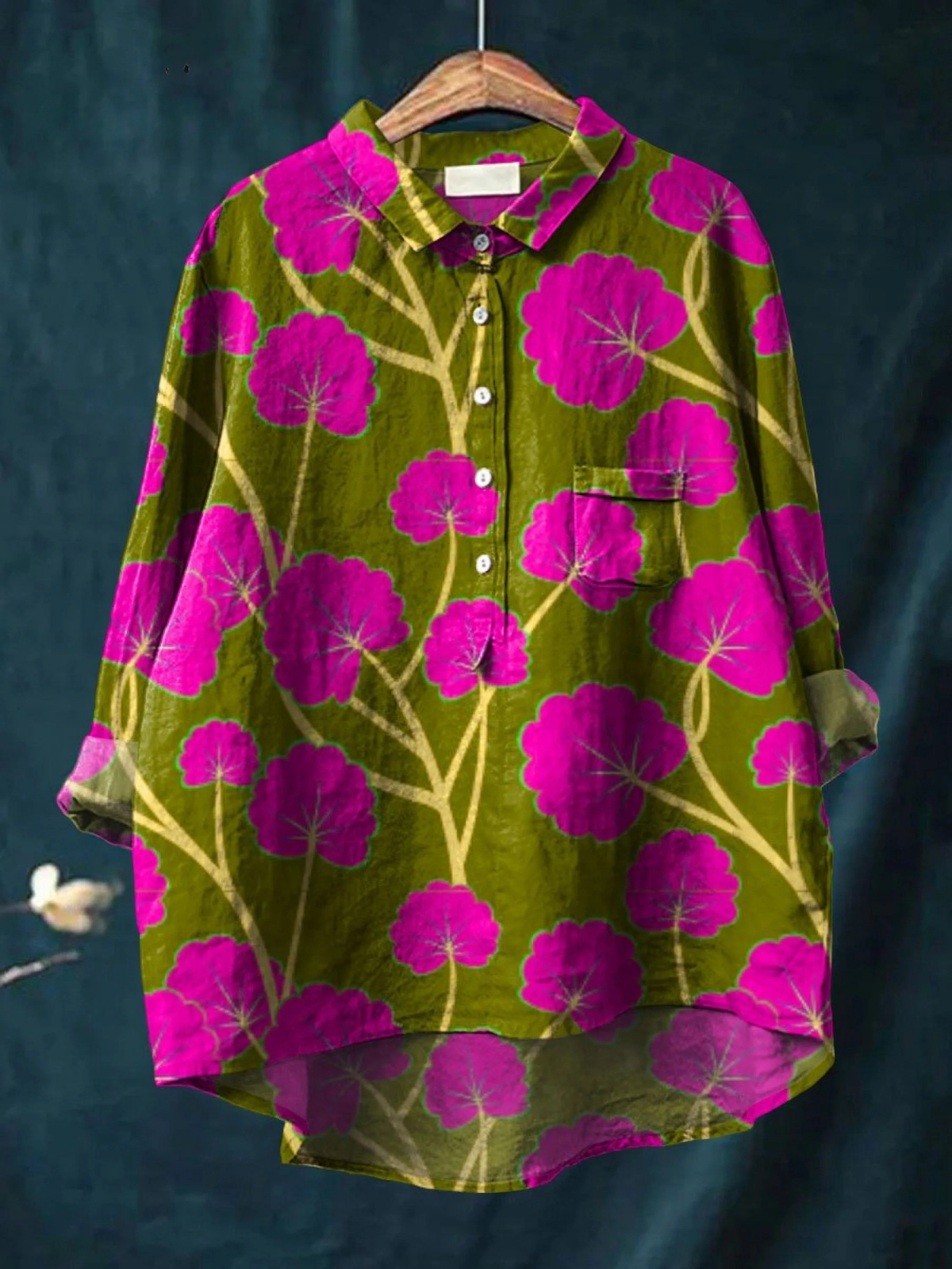 Women’s casual shirt with olive-green base and magenta flower art print, button front.