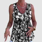 Soft breathable sleeveless top with black-and-white abstract print, V-neck, ruched waist