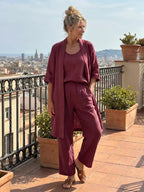 Women's burgundy linen-style set with draped kimono cardigan and wide-leg pants