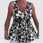 Soft breathable sleeveless top with black-and-white abstract print, V-neck, gathered waist