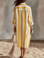 Yellow and white striped midi dress, back view, relaxed silhouette, long sleeves