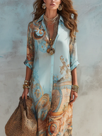 Light blue baroque-print chiffon maxi dress with V-neck, button front, flowing sleeves