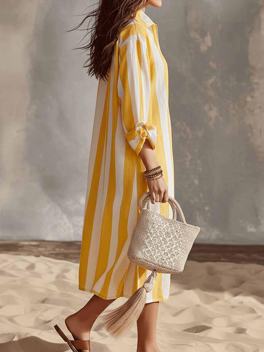 Yellow and white striped midi dress with side tie detail, quarter sleeves, tassel hem