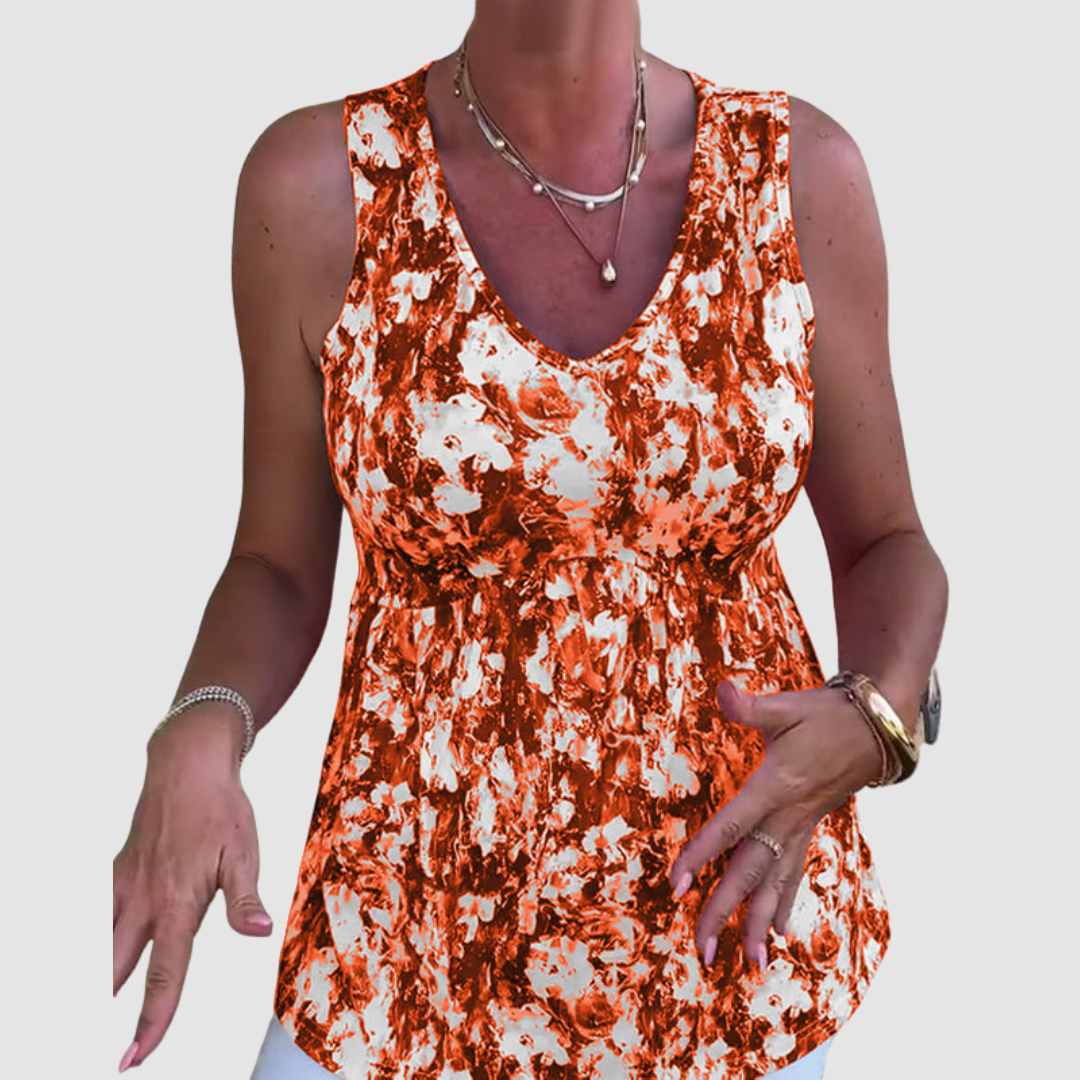 Soft breathable sleeveless top with orange-and-white abstract print, V-neck, gathered waist