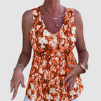 Soft breathable sleeveless top with orange-and-white abstract print, V-neck, gathered waist