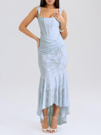 Blue floral maxi dress with ruched waist, fitted bodice, and flared mid-calf skirt.