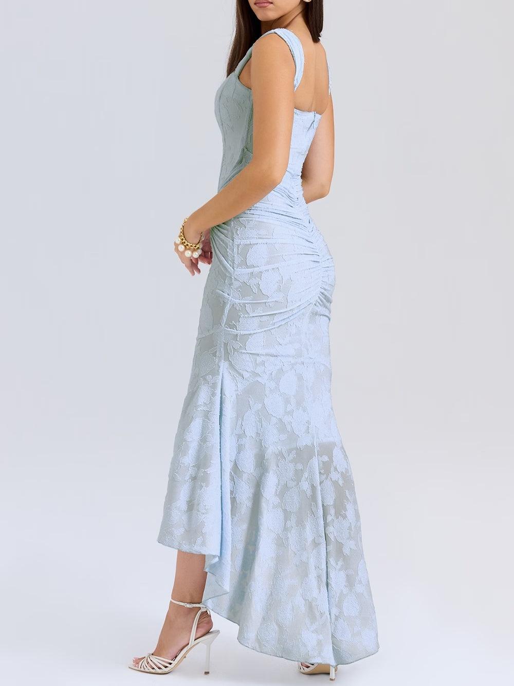 Blue floral sleeveless maxi dress with ruched waist detail and flared hem.