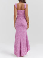 Pink floral maxi dress with sleeveless scoop-back design, ruched waist and long flared skirt