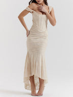 Cream sleeveless maxi dress with square neckline, ruched seams, asymmetrical hem