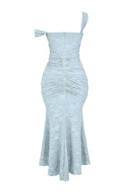 Light blue floral maxi dress with ruched center seam, fitted silhouette and flared hem.