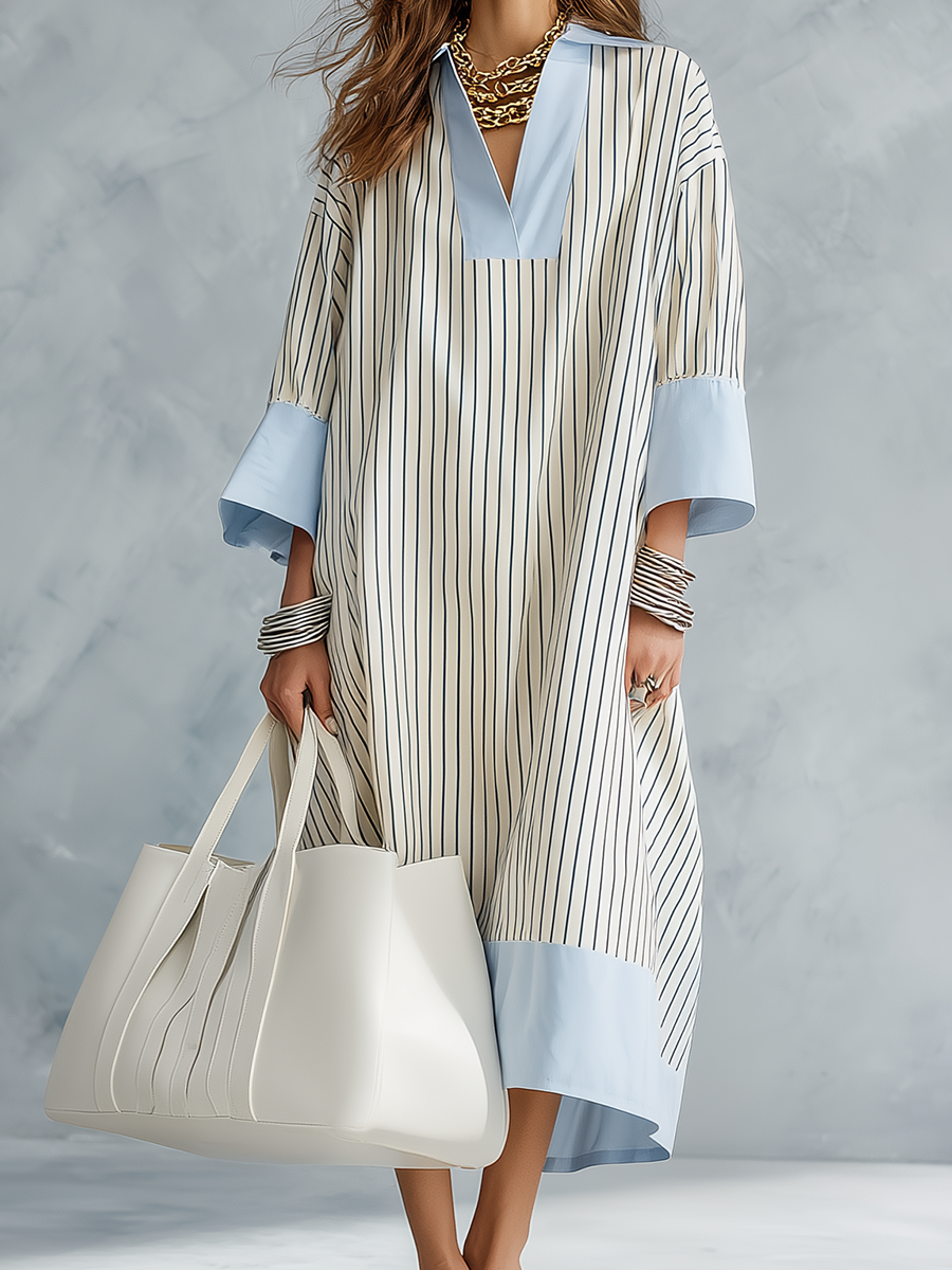 Blue and white striped midi dress with V-neck and light-blue sleeve cuffs