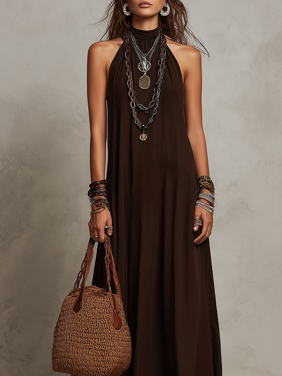 Dark brown halter neck long dress with loose sleeveless fit and flowy skirt