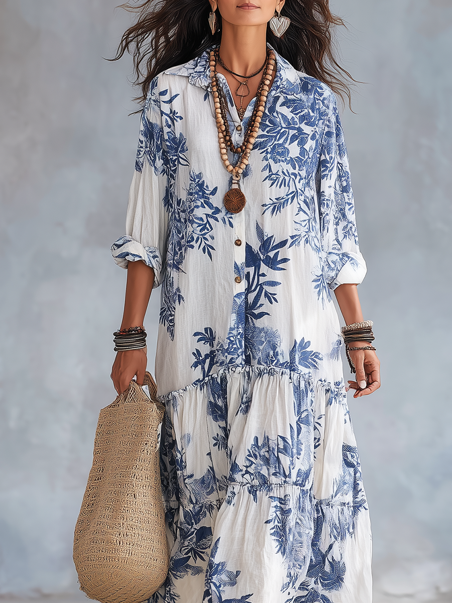 Blue floral button-front maxi dress with gathered tiered skirt and puff sleeves
