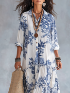 Blue-and-white floral button-front maxi dress with V-neck placket and tiered ruffles