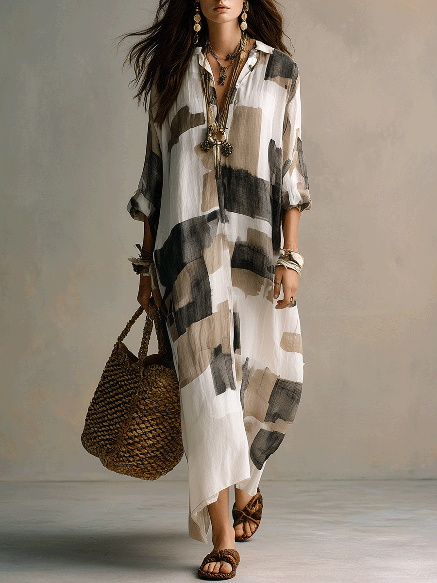 Off-white maxi dress with abstract black-and-gray block print, button-front placket, 3/4 sleeves