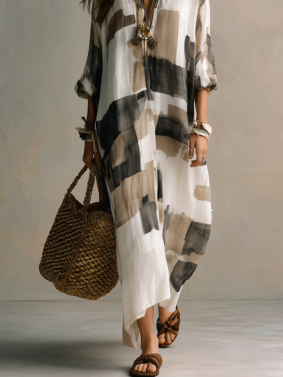 Off-white maxi dress with abstract black-and-gray print, button-front, airy relaxed drape