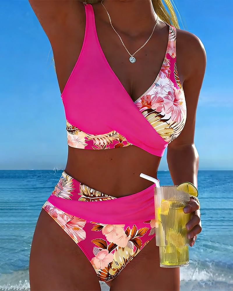 Floral contrast split bikini with magenta halter top and tropical floral high-waist bottoms