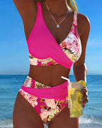 Floral contrast split bikini with magenta halter top and tropical floral high-waist bottoms