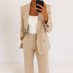 Beige tailored two-piece suit set with blazer and matching trousers, notched lapels.