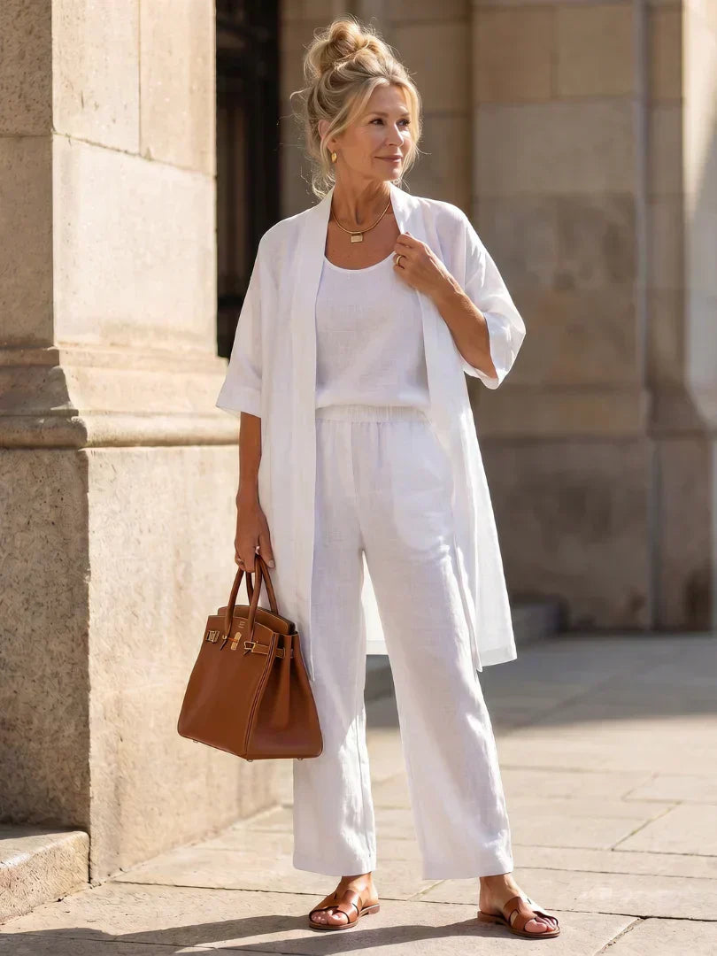 Elegant set with long short-sleeve shirt and wide-leg pants, solid white