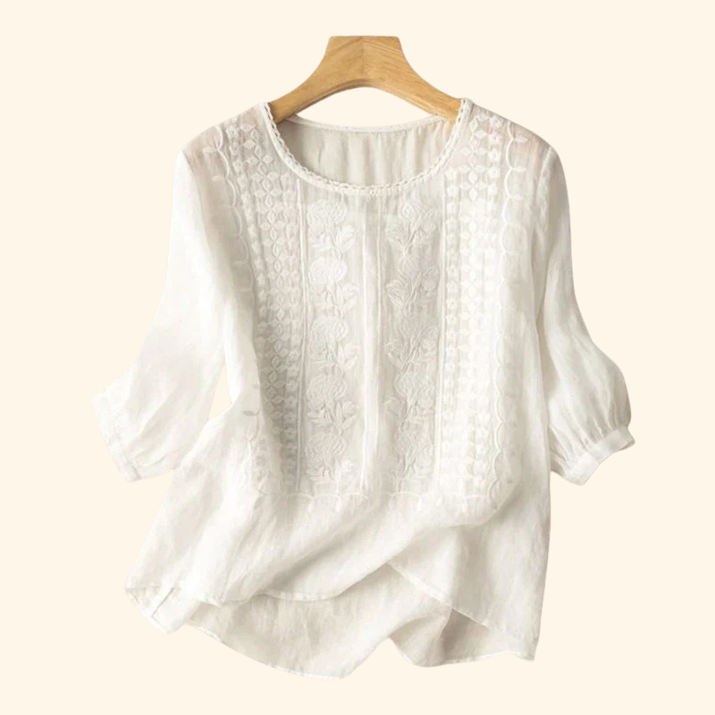 White embroidered blouse, round neck, three-quarter sleeves, textured front panel